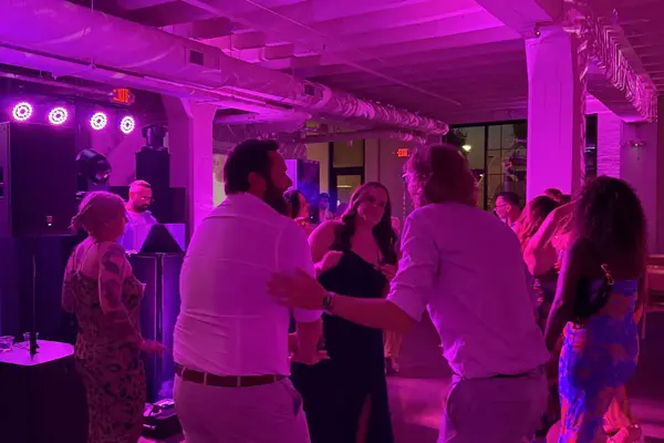 Wedding guests dancing with SoundMN event lighting rental in Minnesota
